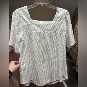 Casual white Swiss dot shirt with cap sleeves